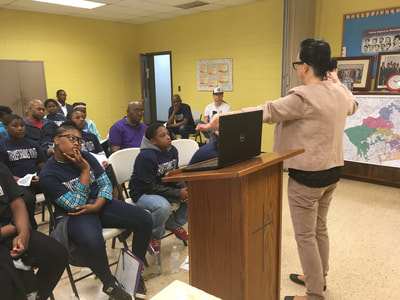 Common Cause GA Exec Dir Sara Henderson teaches the children & parents of Transforming Youth, Inc. the mechanics of Gerrymandering, and how to fight it. 
